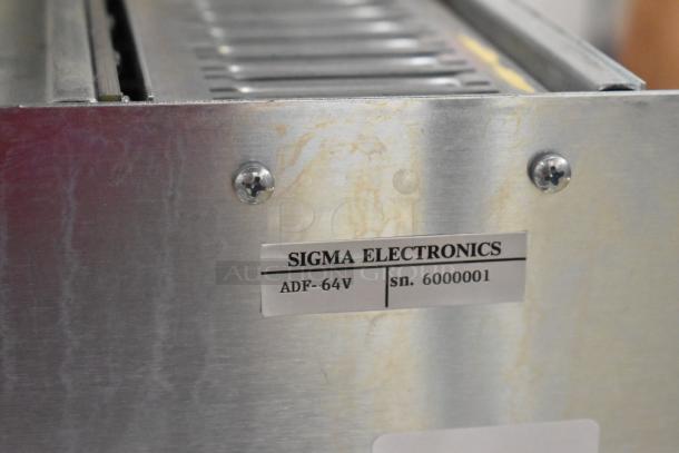 Sigma Electronics ADF-64V Analog & Digital Switcher, sn. 6000001, metal casing; used condition with visible wear.