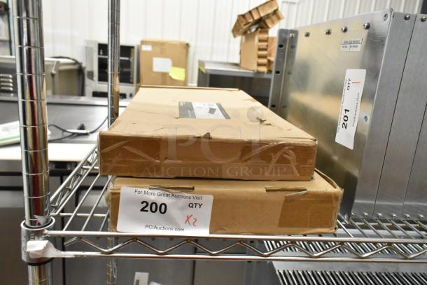 Two new StarTech Cantilever Shelves in original packaging, boxes labeled with item 200 and quantity x2, minor box damage visible.