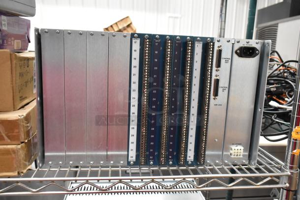 Analog & Digital Switchers A&D Unit, multiple input/output slots, labeled controls, sturdy metal casing, good condition.