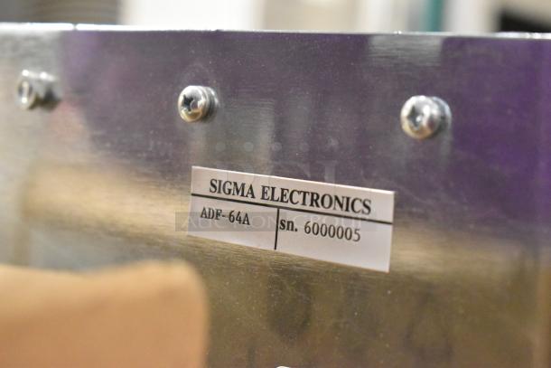 Analog & Digital Switchers A&D Unit, Sigma Electronics ADF-64A, serial no. 6000005, metal casing, visible label.