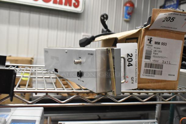 Sigma Electronics SYC-9600 and SBX-32 switchers on shelf, lightly worn. Labels indicate model and catalog details.