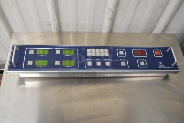 Sigma Electronics SYC-9600 unit featuring digital display panel, labeled controls, and stainless housing. Auction includes two units.