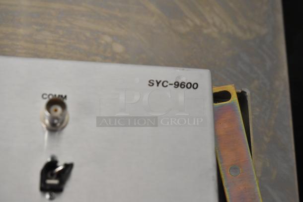 Sigma Electronics SYC-9600 unit with COMM port visible. Includes Analog & Digital Switchers SBX-32. Good condition.