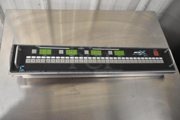 Sigma Electronics SYC-9600 and SBX-32 switchers, featuring multiple inputs and digital displays; marked with brand logo.