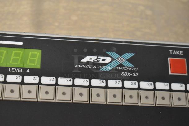 Sigma Electronics SYC-9600 and A&D Switchers SBX-32. Features digital display, labeled buttons, in good condition.
