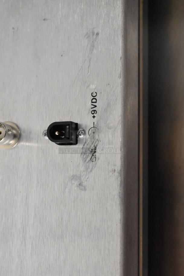 Sigma Electronics SYC-9600 connector panel with +9VDC marking, indicating power input requirements. Appears in fair condition.