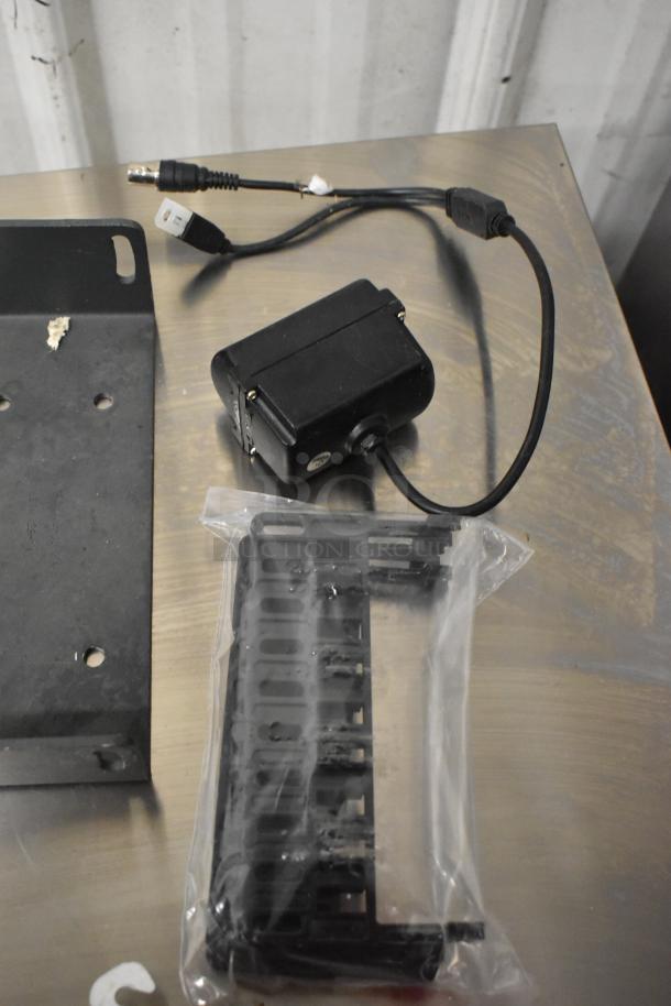 Lot of various items including wires, a black Siemens TRI-R unit, mounting bracket, and plastic component, all in used condition.