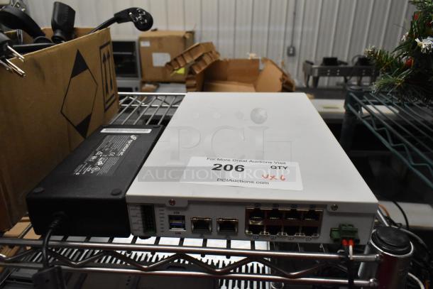 6 items including Avigilon VMA-ENVR1-8P8 NVR, visible ports, power supply, auction label "206 qty x6".