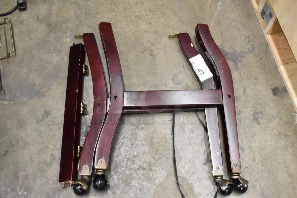 Disassembled chair parts, dark wood finish, includes legs with caster wheels. Tag reads "Lot 201". Condition appears used.