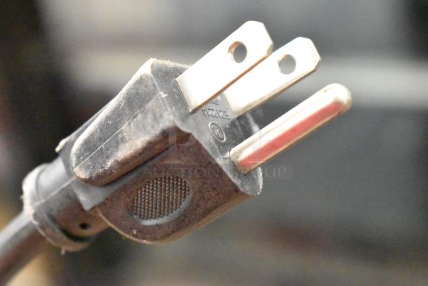 Close-up of a power plug for IDW G-5-0234B Cooler, 115 Volts, 1 Phase, indicating electrical compatibility.