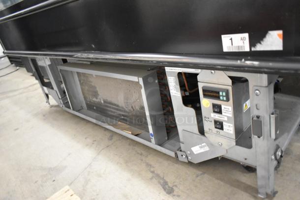 Structural Concepts metal commercial island merchandiser, floor style, grab-n-go design. Features visible power switch panel, moderate wear.