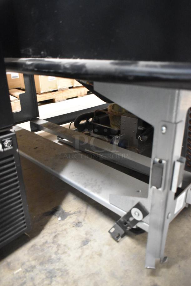 Structural Concepts metal floor style island horizontal grab n go merchandiser, visible frame and components, commercial use.