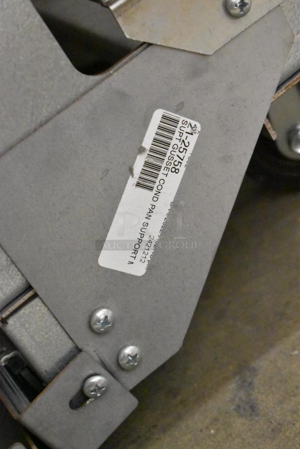 Structural Concepts metal commercial merchandiser, robust design, visible tag reads "COND PAN SUPPORT A", model 2421212.