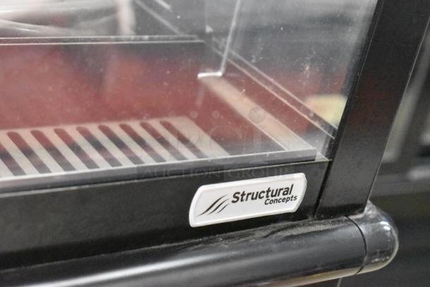 Structural Concepts metal grab-n-go merchandiser, floor style, with glass display and branded label. Ideal for commercial use.