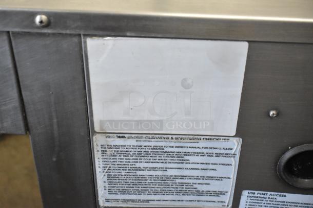 Stoelting stainless steel 2-flavor soft serve ice cream machine, countertop model. Features cleaning and sanitizing checklist label.