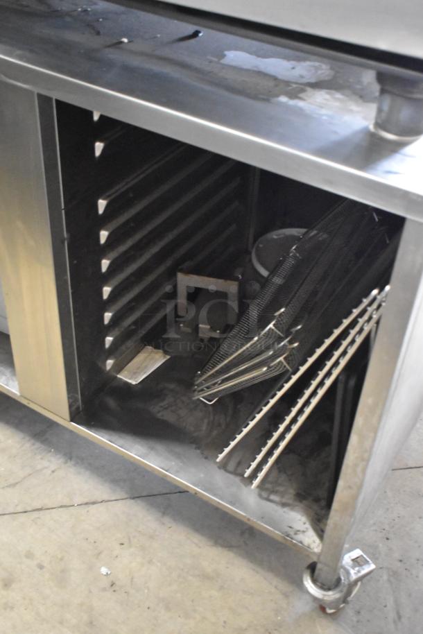 Stainless steel Rational SCC WE 62 combi convection oven; commercial-grade, double pan rack, 480V, 3-phase, on equipment stand.