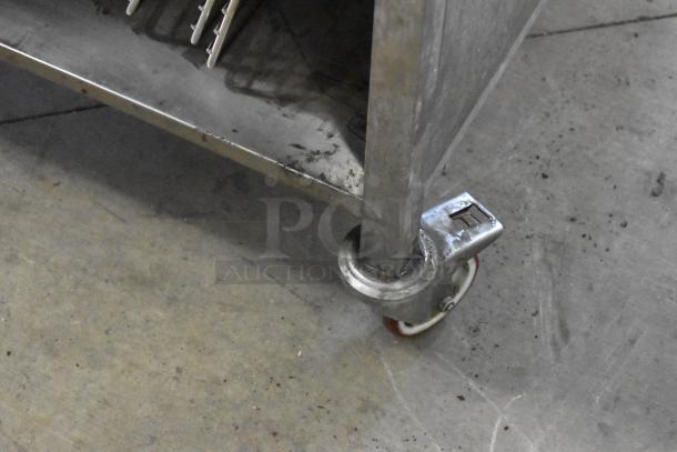 Stainless steel Rational SCC WE 62 oven on double pan rack; visible caster detail, slight wear, 2019 model.