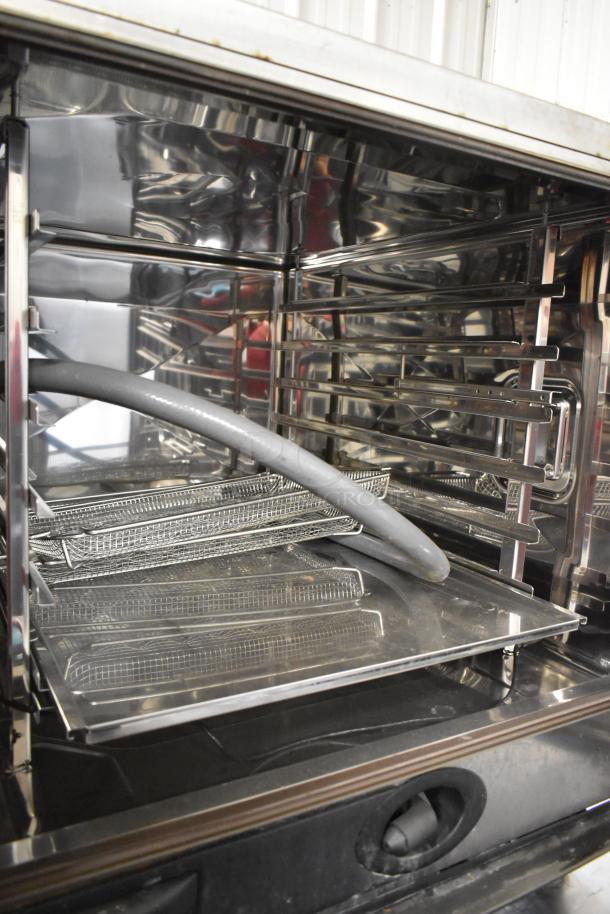 2019 Rational SCC WE 62 stainless steel combi convection oven, commercial use. Features double pan rack, 480V, 3-phase power.