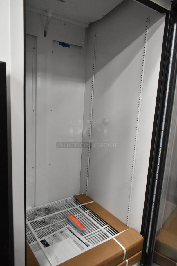 2021 True TSCI-600R-G-PH single door cooler, metal build, poly-coated racks, 115V, 1 phase; pristine condition.