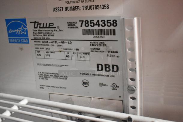True GDM-41SL-60-LD Cooler label, showing model, serial number 7854358, 115V, 1 phase, and NSF certification.