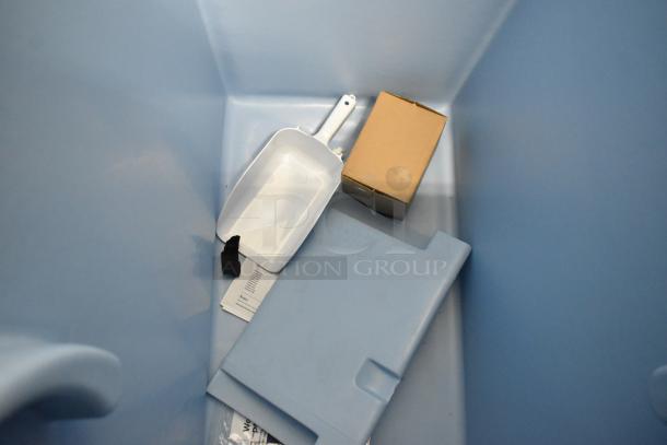 Stainless steel Avantco 194BIN40022 ice storage bin, 383 lb capacity, new, with visible scoop, box, and minor interior dents.