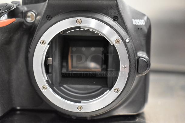 Nikon D3500 digital camera body, no lens, black, visible mount, used condition, model label "D3500" on the side.
