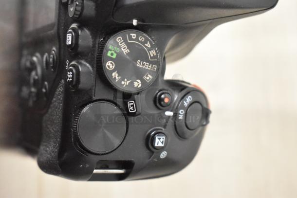 Nikon D3500 digital camera body, no lens. Features mode dial, power switch, and buttons visible. Good condition.
