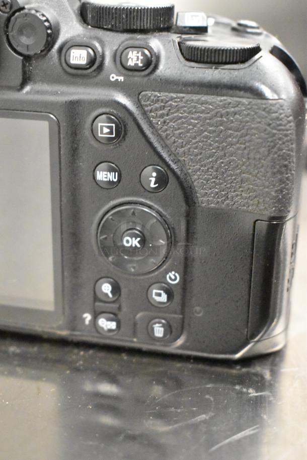Nikon D3500 digital camera back view, showing buttons and screen. No lens included. Good condition.