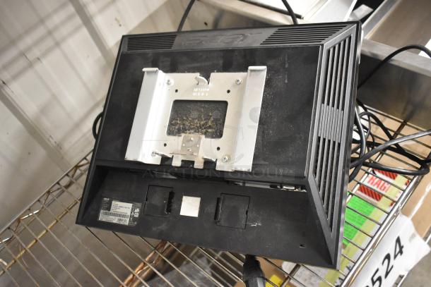 Acer V173 17" LCD monitor, black, visible dust, rear view showing VGA port and mounting bracket, model and serial labels.