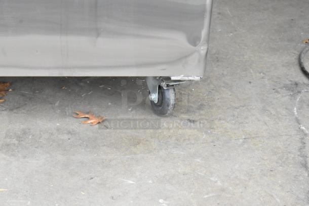 2018 Atosa MBF8005GR stainless steel cooler, dented corner on caster, poly coated racks, commercial casters.