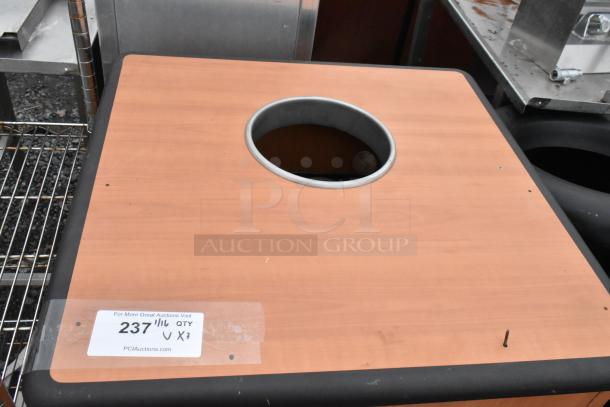 3 trash can shells, 2 black, 1 wood pattern. Good condition. Label: "237", "QTY X3". Auction by PCIAuctions.com.