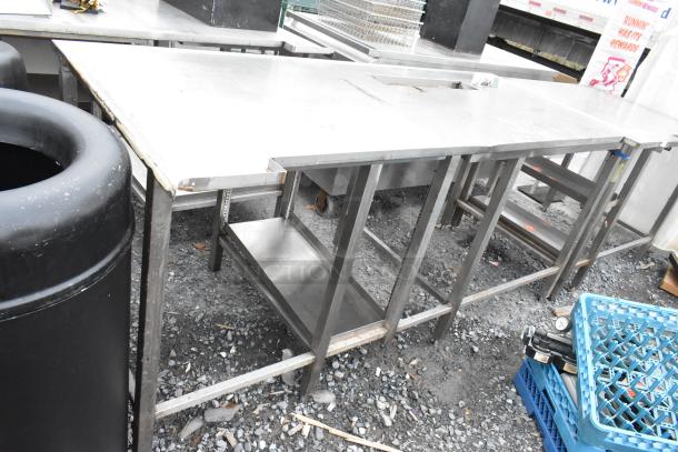 Stainless steel soda station table with under-shelf; used condition, showing signs of wear; ideal for commercial use.