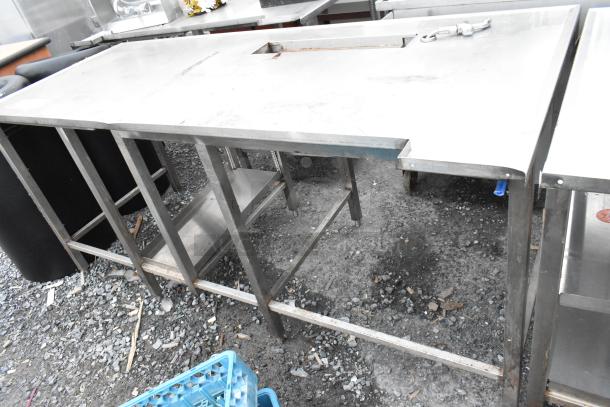 Stainless steel soda station table with open shelving, durable construction, and a slot for dispensing equipment. Good condition.