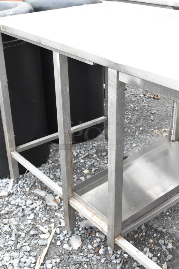 Stainless Steel Soda Station Table, durable, with visible wear and minor rust. Ideal for commercial use.