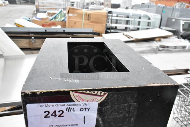 Black drop safe with top slot. Visible wear. No combination provided. Auction label with number 242 attached.