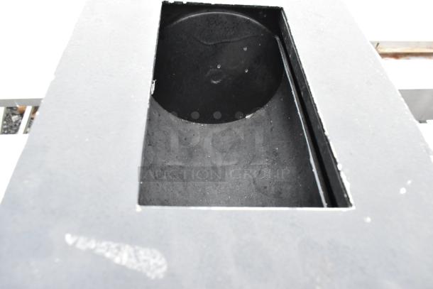 Black drop safe with no combination included, features a rectangular drop slot on top, evident wear visible.