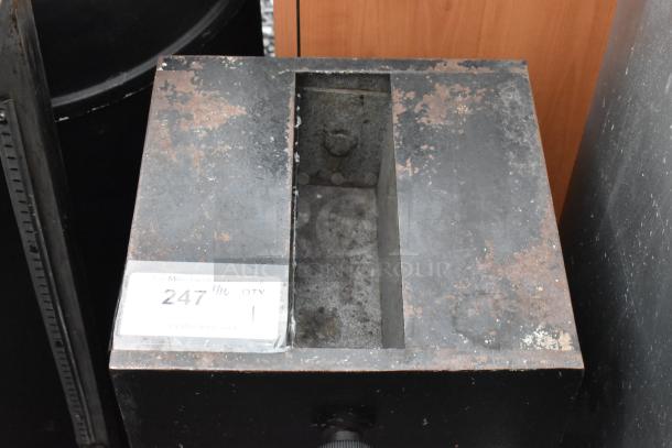 Black metal single compartment safe, worn condition, no combination provided. Auction lot label on front.