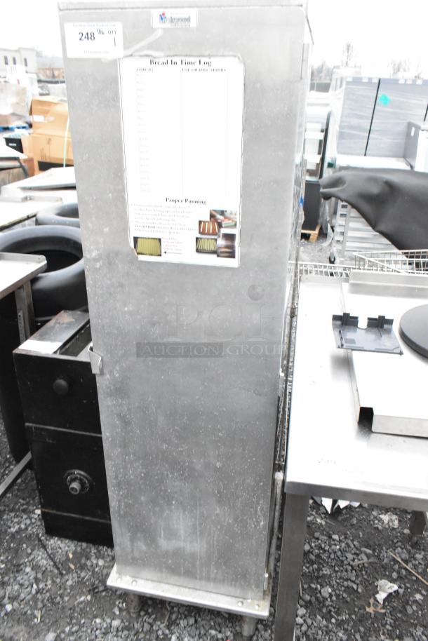 Lockwood CA60-RR25 metal commercial enclosed pan rack with visible baking pans, slight wear, and Bread In Time Log label.