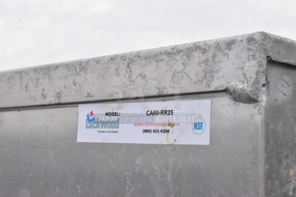 Lockwood CA60-RR25 metal commercial enclosed pan rack with visible wear. Features model label with contact info.