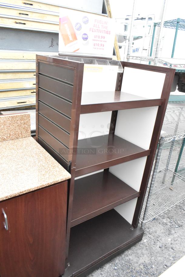 Wood pattern shelving unit with three shelves, brown finish, vertical side panels, minor surface wear.
