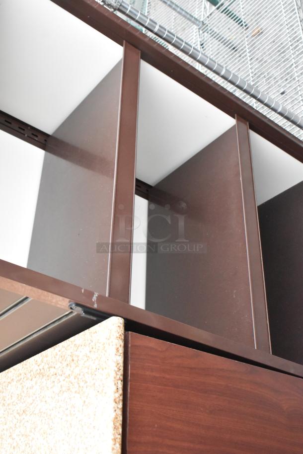 Wood pattern shelving unit with brown finish, featuring multiple sections. Appears in good condition, no visible markings.