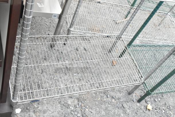 Chrome finish 2-tier wire shelving unit, chrome and green frames, NSF label visible, dismantling required by buyer.