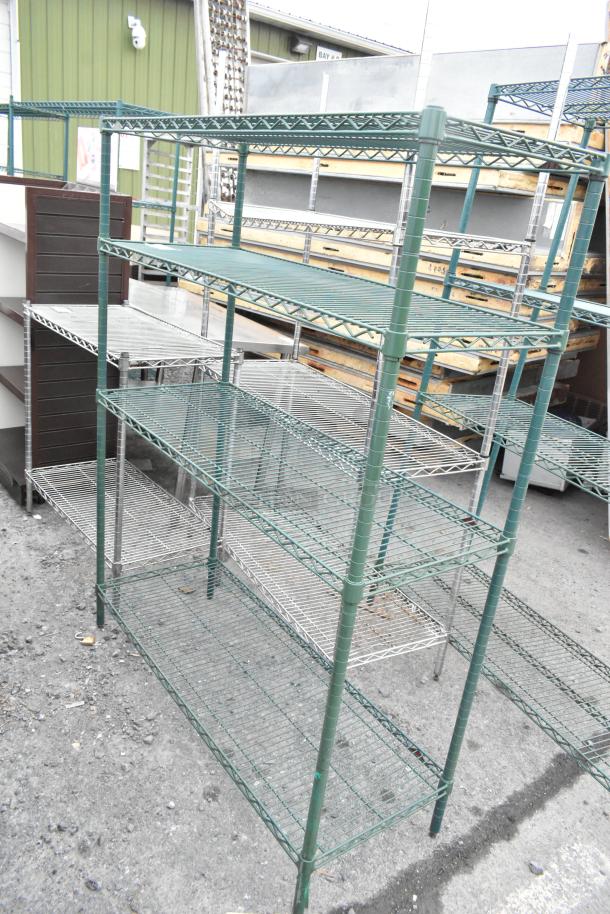 Green finish 4-tier wire shelving unit in used condition. Buyer must dismantle for shipping; consider freight charges.
