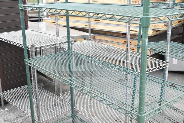 Green finish 4-tier wire shelving unit, sturdy construction, minor wear. Buyer must dismantle. Consider freight costs.