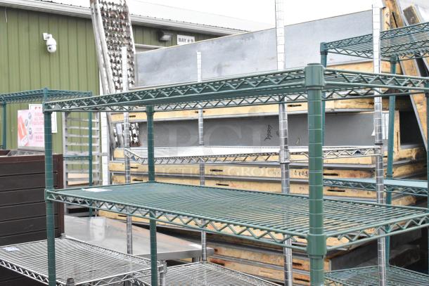 Green finish 4-tier wire shelving unit in good condition, suitable for various storage needs. Buyer must dismantle.