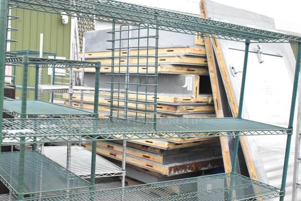 Green finish 4-tier wire shelving unit, sturdy design, ideal for storage. Buyer must dismantle. Consider freight charges.