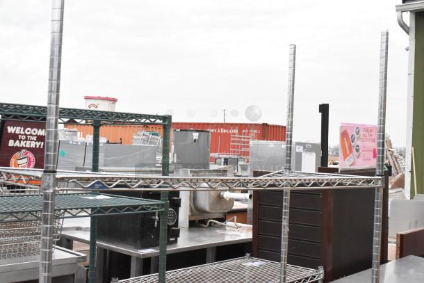 Chrome finish 3-tier wire shelving unit in good condition. Buyer must dismantle; consider freight charges.