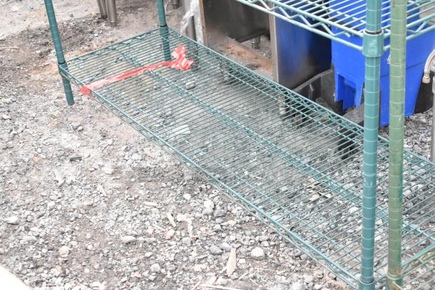 Green 4-tier wire shelving unit, sturdy, with red tape, needs dismantling by buyer, freight charges applicable.