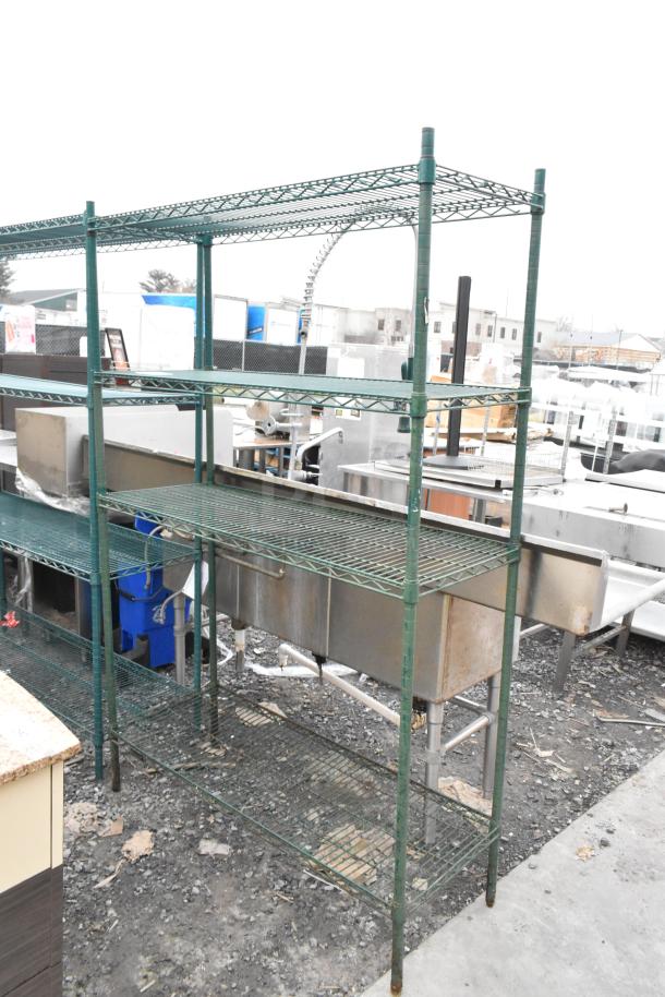 Green finish 4-tier wire shelving unit, used condition. Buyer must dismantle for shipping; consider freight charges.
