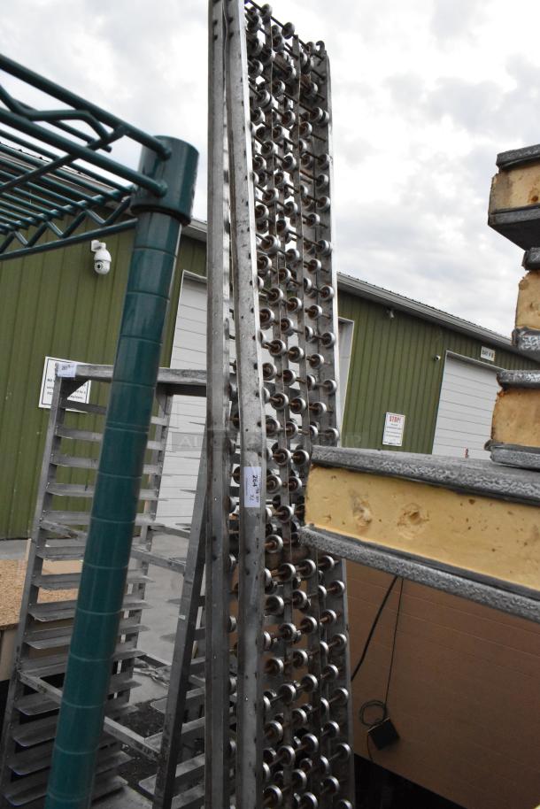 Two rolling conveyor belts, metallic, vertical structure, visible industrial setting, good condition. Label reads "268" and "WX2."